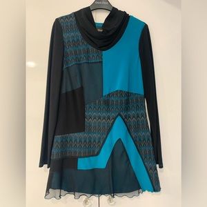 Color Block with sweater knit and sheer trim detail. Turquoise and black.
